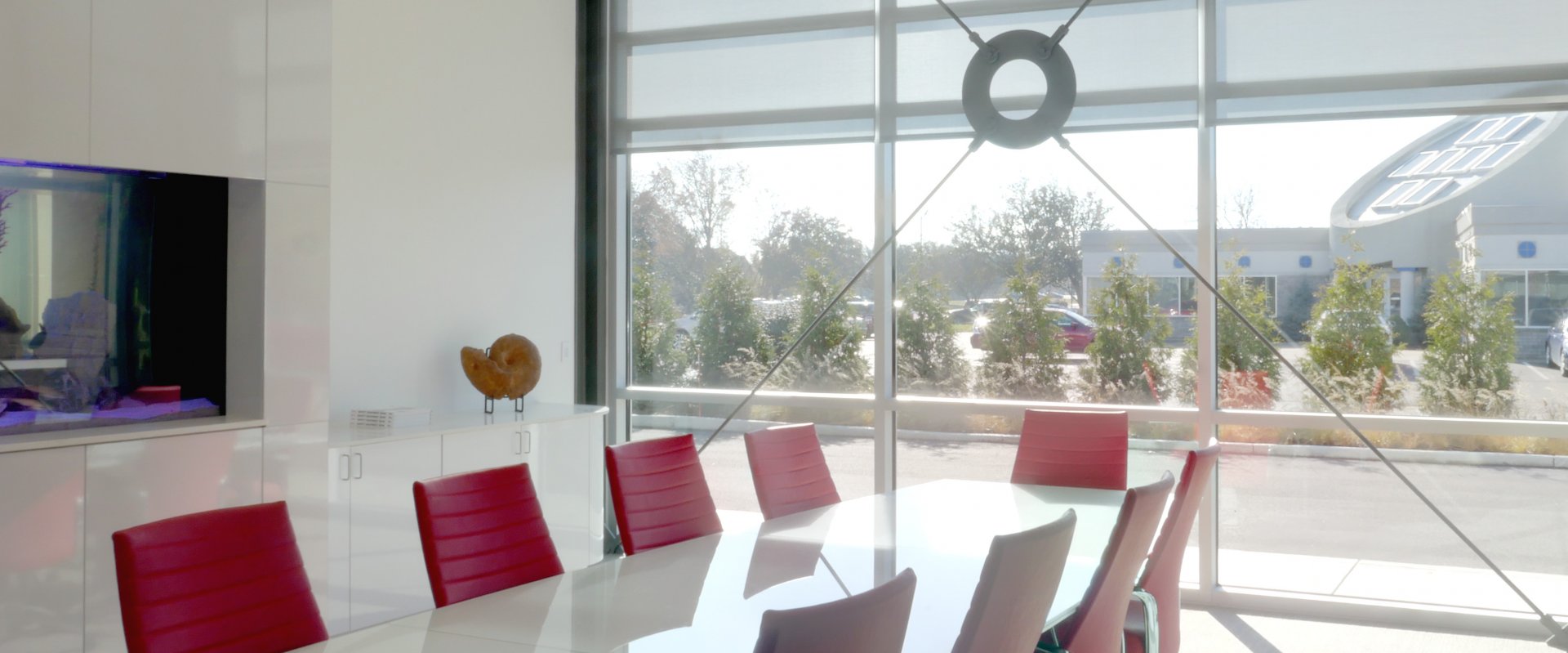 a conference room with a large window shade